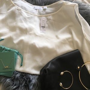 Cream color top w/ cold shoulder tie sleeves